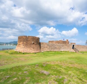 Historic stone walls of Fortaleza San Felipe overlooking the ocean in Puerto Plata, a scenic excursion stop on the 2027 Christian Marriage Cruise.
