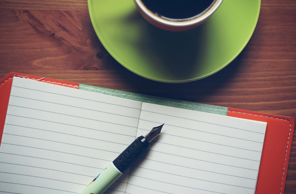 marriage retreat curriculum, open notebook and coffee in warm morning light